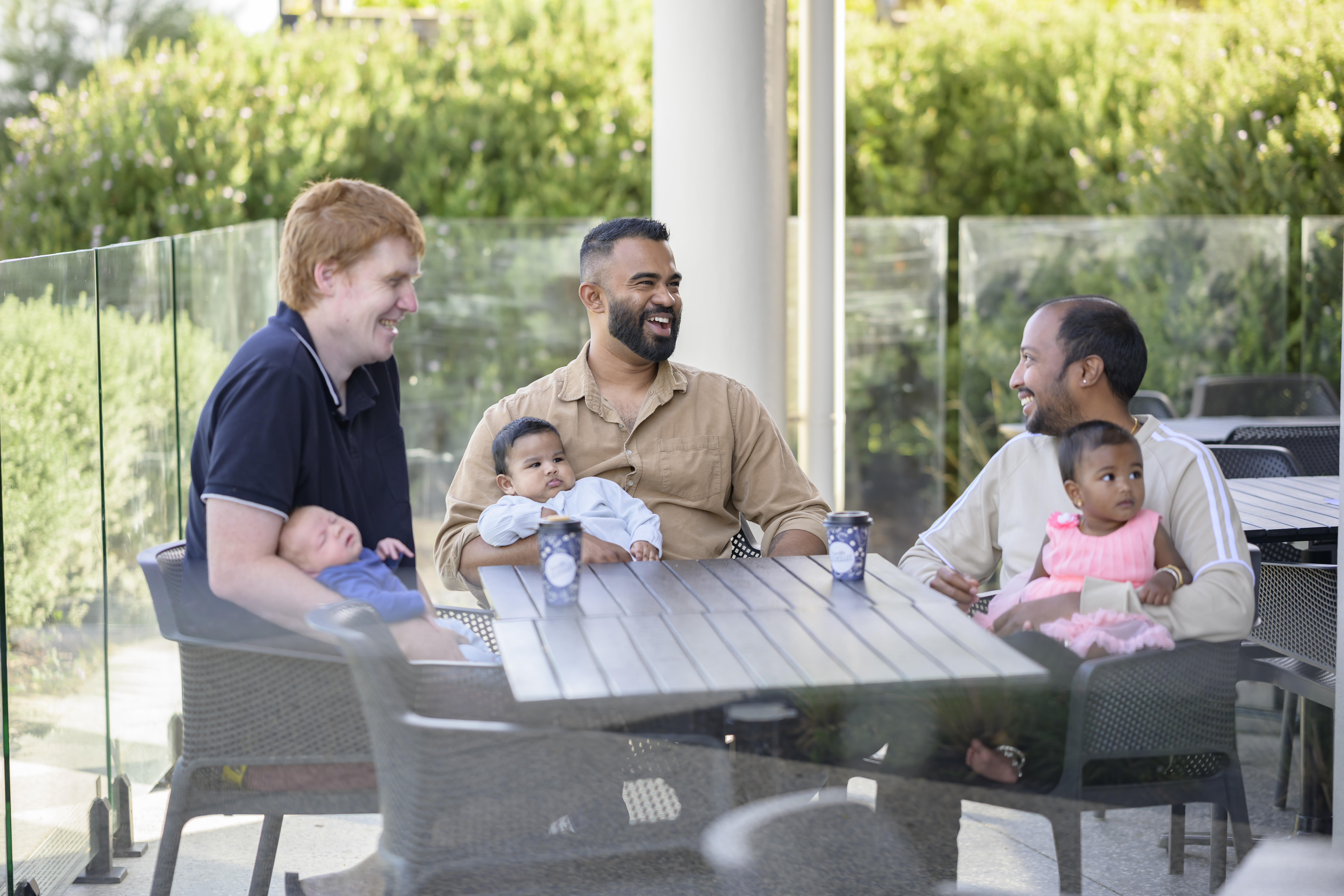 Group of Dad's with their kids around a table