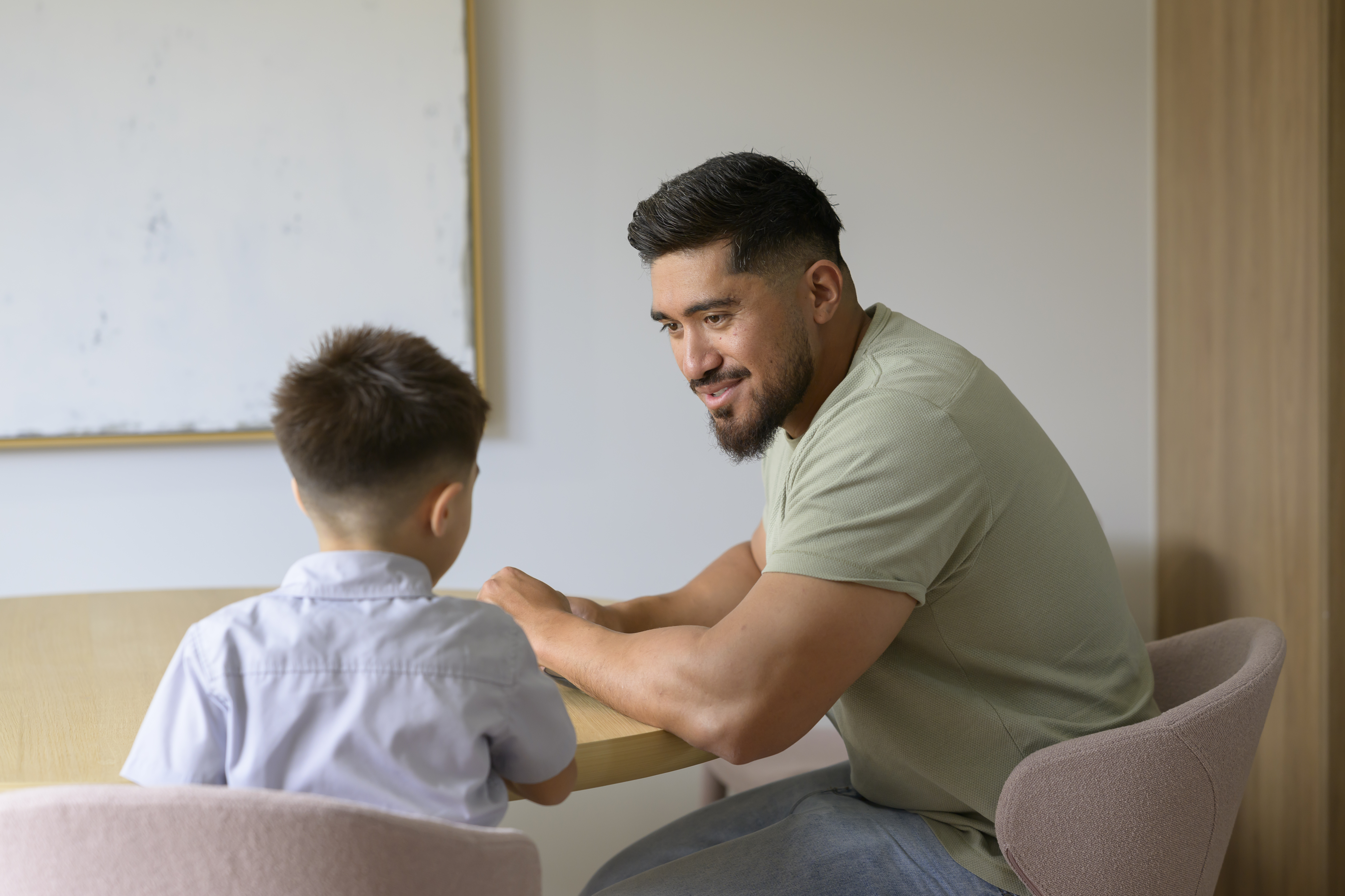 Dad talking to his son