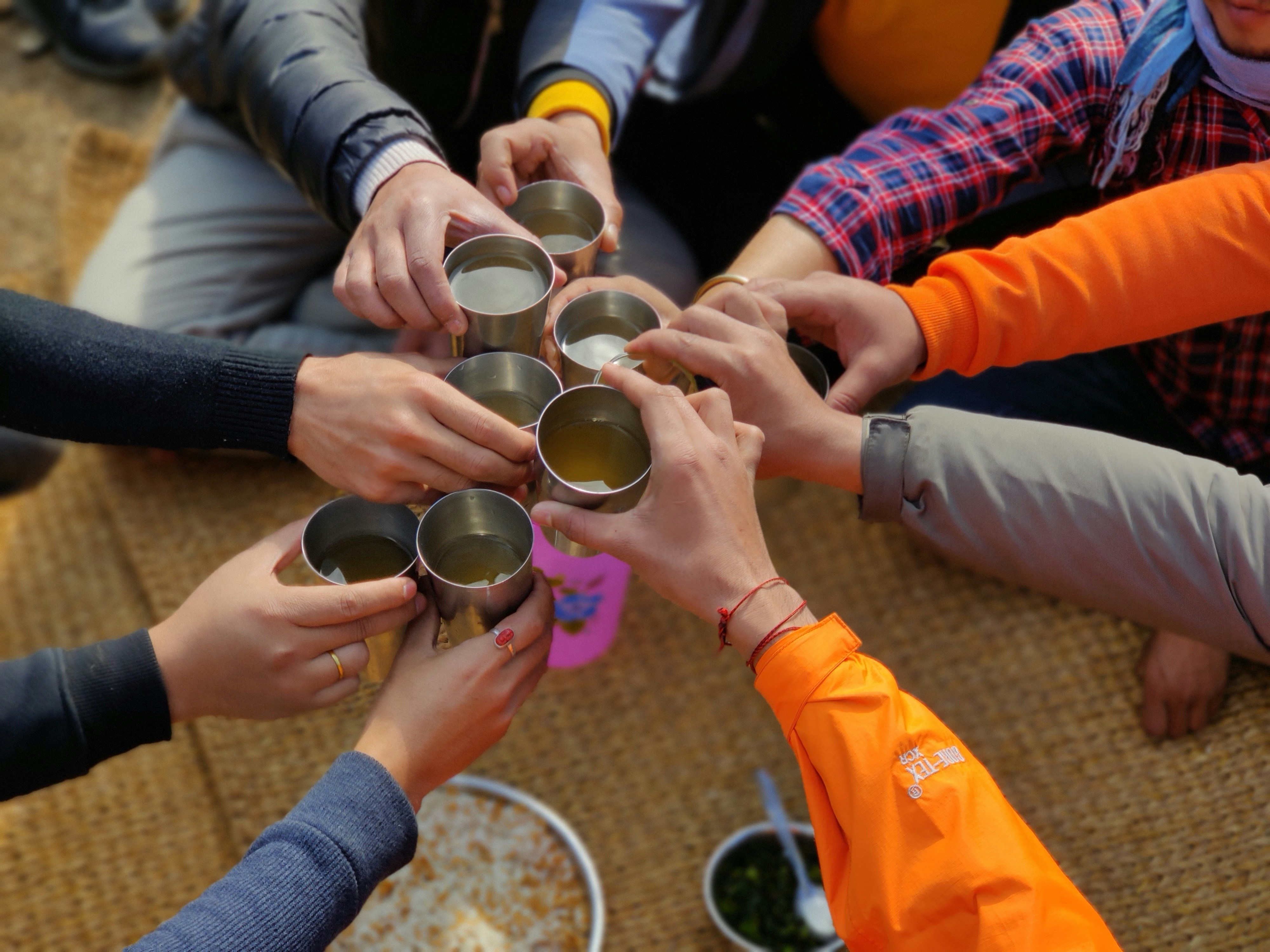 coffee and tea hands together
