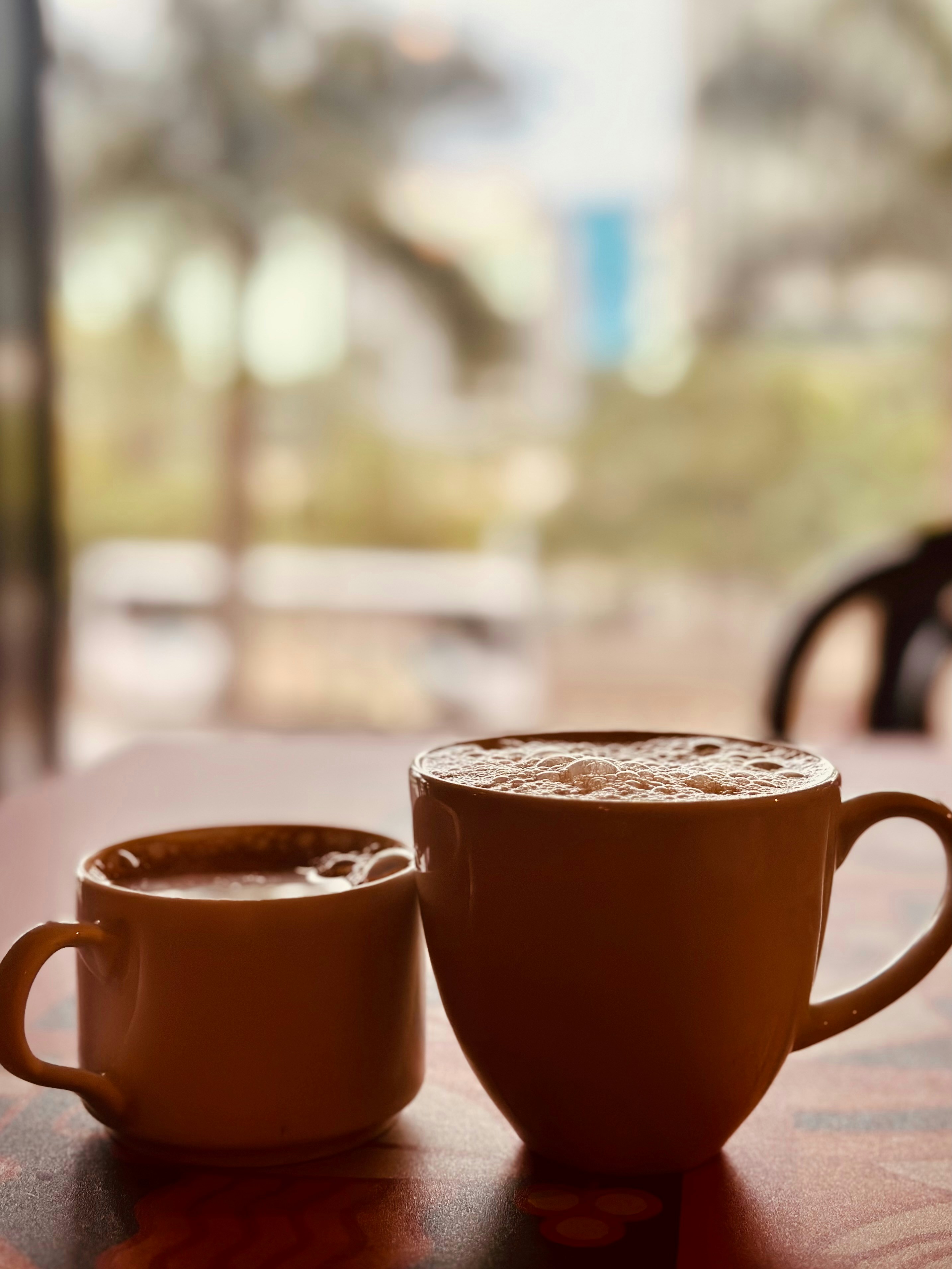 2 cups of coffee on a table