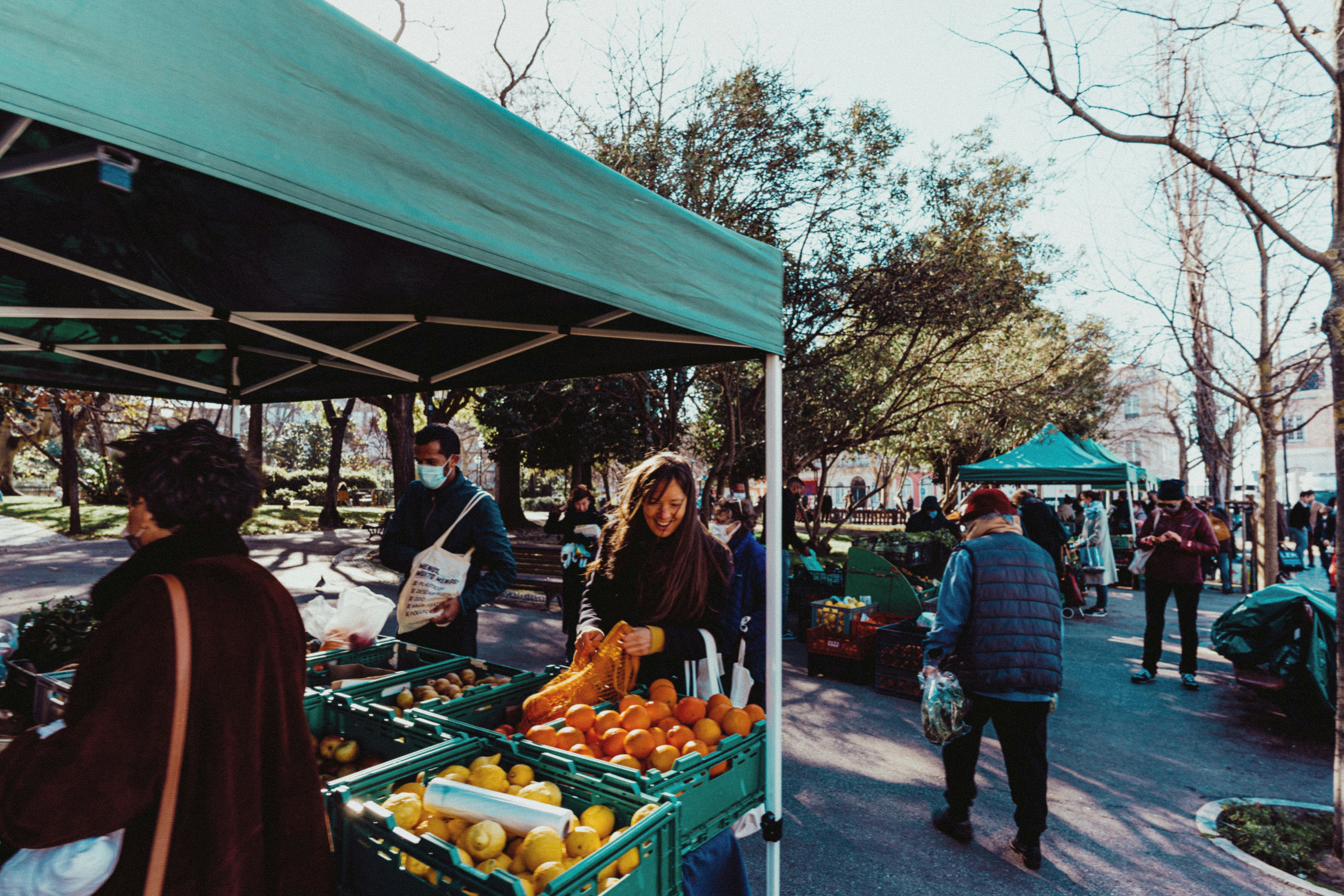 People walking around an outdoor market