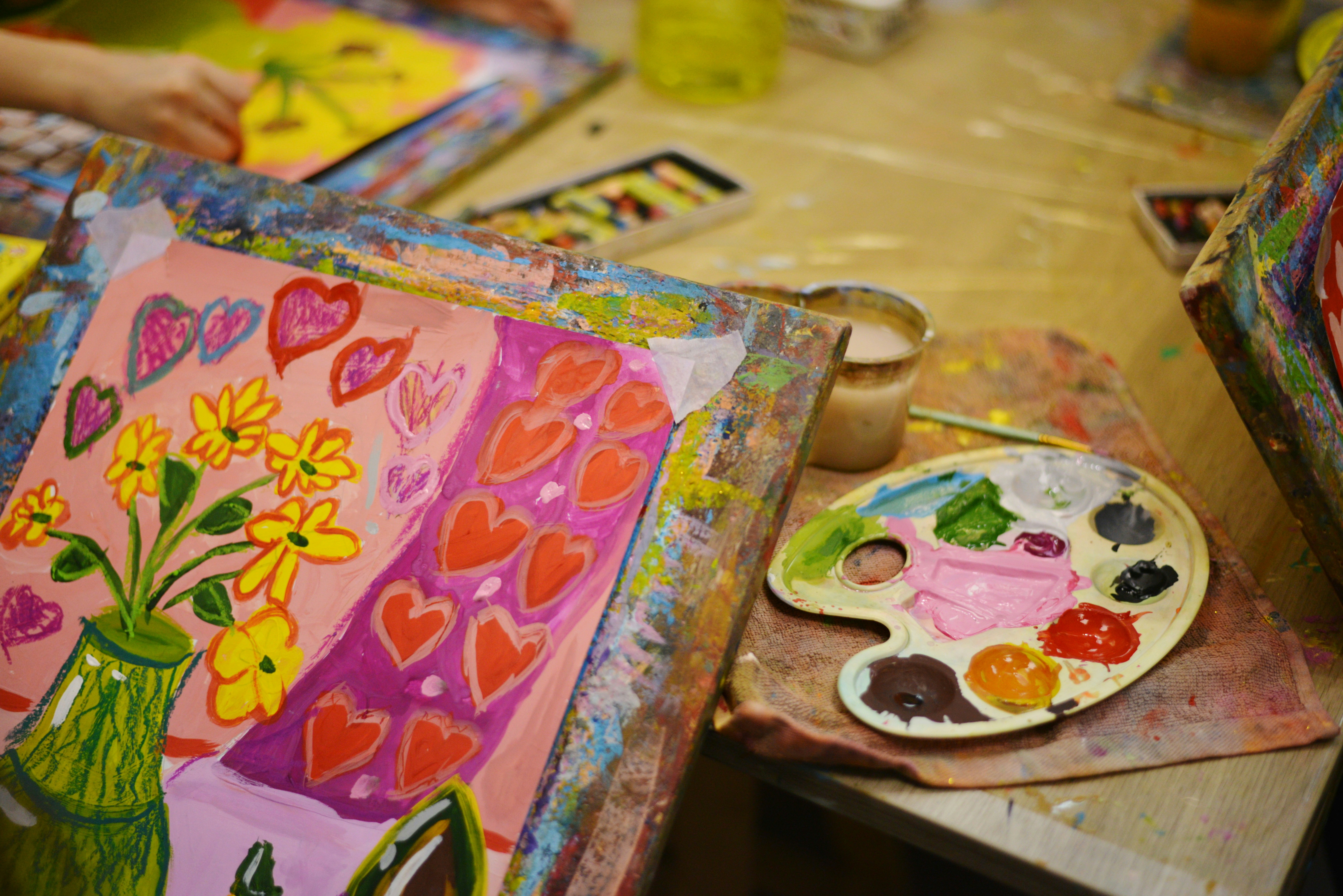 Painting in progress of flowers