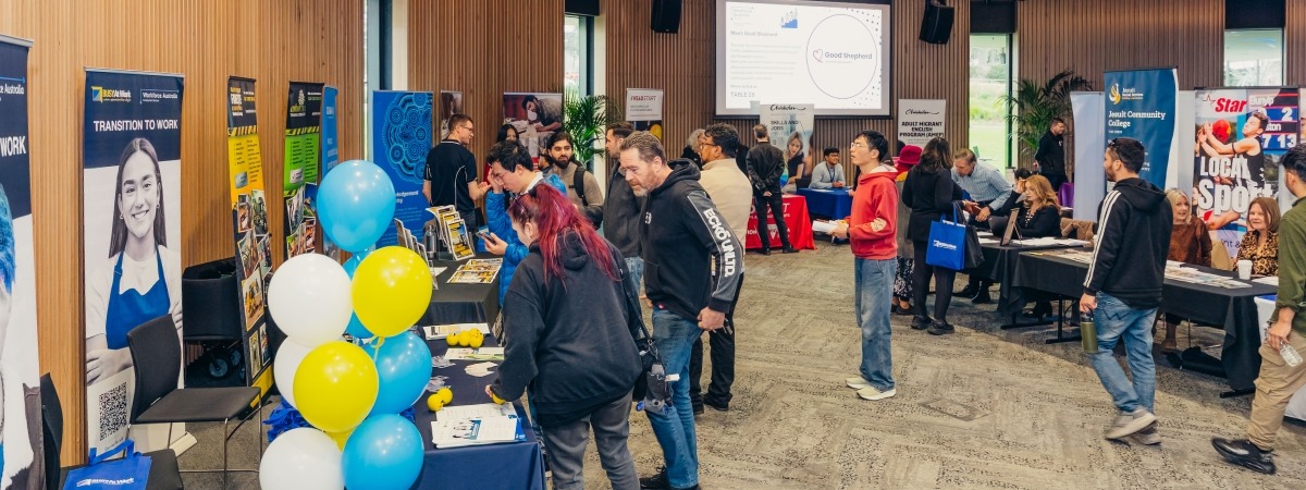 attendees browsing stalls at the event