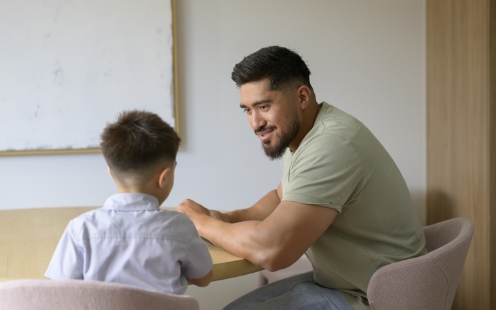 Dad talking to his son