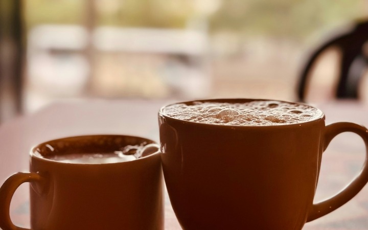 2 cups of coffee on a table