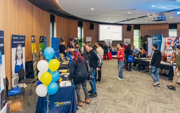 attendees browsing stalls at the event