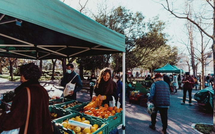 People walking around an outdoor market