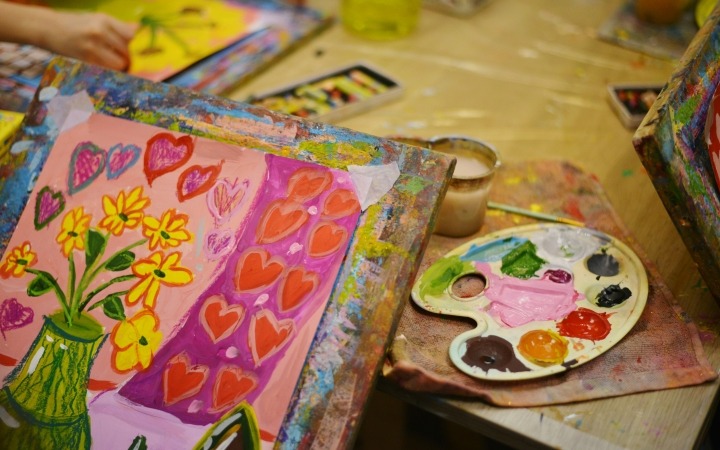 Painting in progress of flowers
