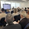 Group of people watching a presentation