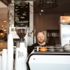person making a coffee at a cafe