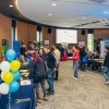 attendees browsing stalls at the event